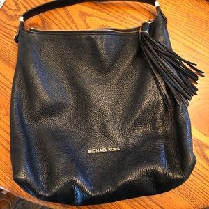 Black leather purse with gold accents
